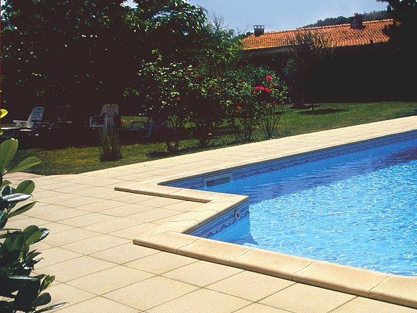 Smooth Fouras pool coping stones in buff colour with matching paving